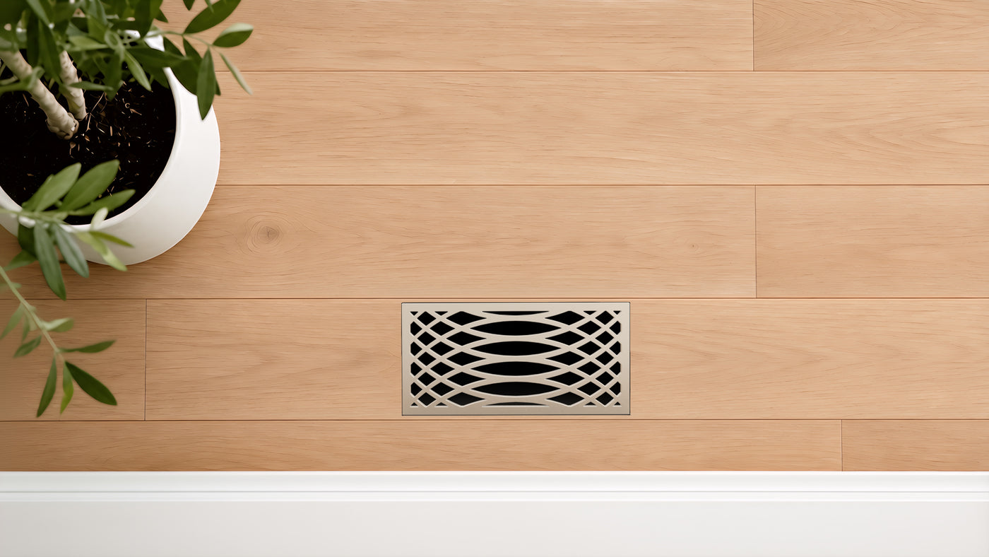 Lattice · Gloss Silver flush floor vent in a wood floor